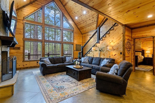 living room with wood ceiling, high vaulted ceiling, and concrete floors