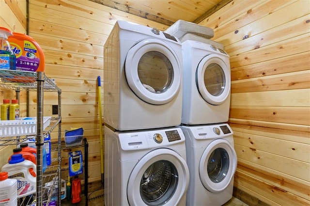 washroom with wood walls, wooden ceiling, and stacked washer and clothes dryer