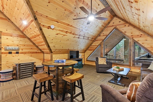 playroom with ceiling fan, wood ceiling, wooden walls, and vaulted ceiling