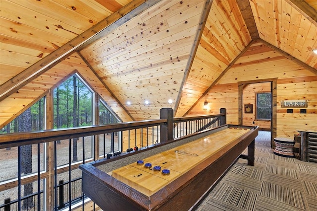 playroom with lofted ceiling with beams, wooden ceiling, and wooden walls