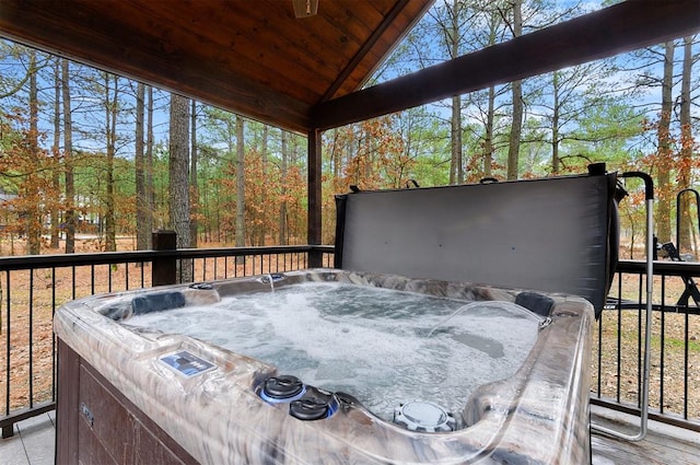 wooden terrace with a hot tub