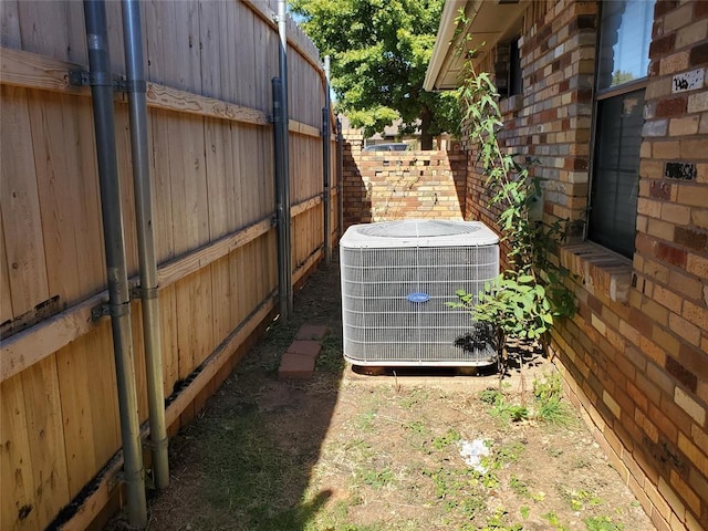 view of yard with central air condition unit