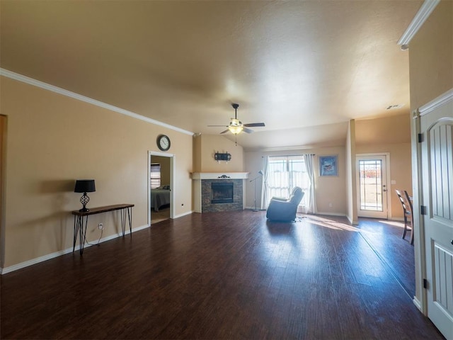 unfurnished living room with a fireplace, crown molding, hardwood / wood-style floors, and ceiling fan