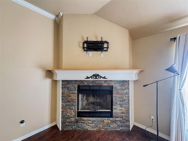 room details featuring hardwood / wood-style floors, a stone fireplace, and ornamental molding