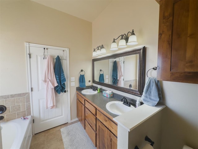 bathroom featuring vanity, tile patterned floors, and a bathing tub