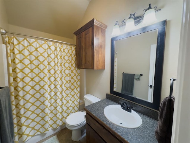 bathroom with vanity, toilet, walk in shower, and lofted ceiling