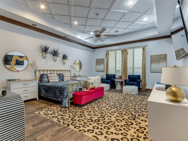 bedroom featuring ornamental molding, dark hardwood / wood-style flooring, ceiling fan, and coffered ceiling