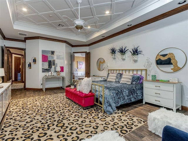 bedroom with ceiling fan, ornamental molding, dark wood-type flooring, and coffered ceiling