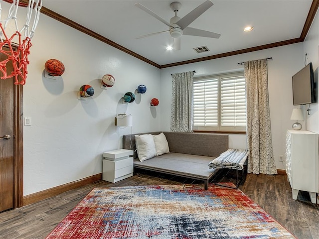 living area featuring dark hardwood / wood-style floors, ceiling fan, and ornamental molding