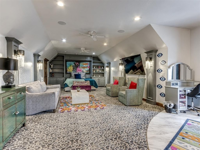 playroom featuring carpet flooring, built in shelves, vaulted ceiling, and ceiling fan