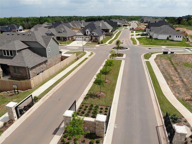 view of street with a residential view, curbs, and sidewalks