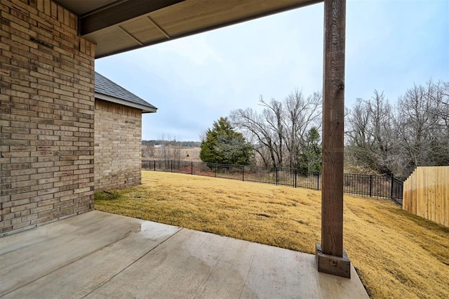 view of yard with a patio area and a fenced backyard