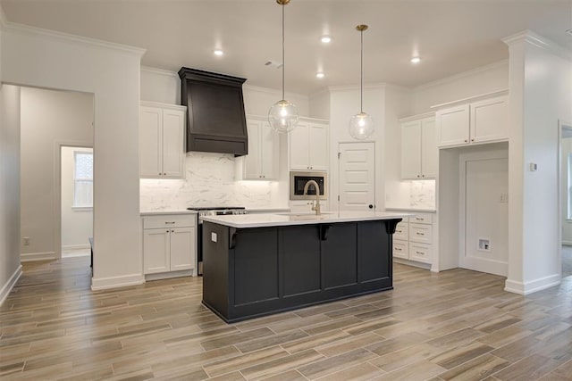 2348 Ridge Pine Rd, Edmond, OK 73034 - kitchen with stainless steel range oven, premium range hood, white cabinets, backsplash, and light countertops