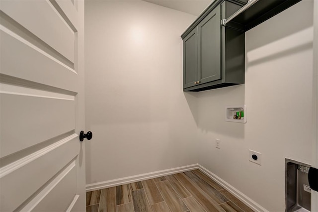 2348 Ridge Pine Rd, Edmond, OK 73034 - washroom featuring cabinet space, hookup for an electric dryer, dark wood-type flooring, and hookup for a washing machine