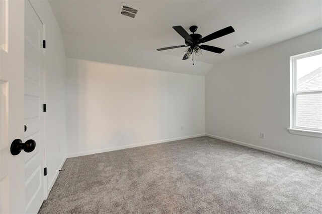 2348 Ridge Pine Rd, Edmond, OK 73034 - empty room with carpet, vaulted ceiling, and a ceiling fan