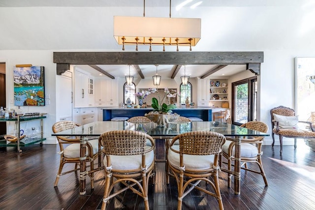 dining room with vaulted ceiling with beams and dark hardwood / wood-style floors