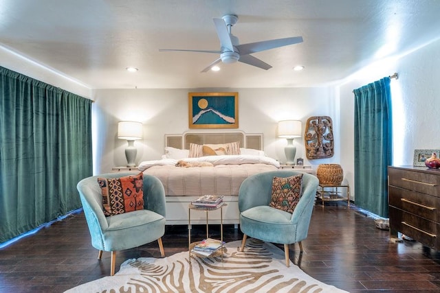 bedroom with dark hardwood / wood-style floors and ceiling fan