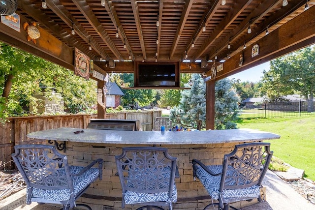 view of patio with exterior bar and grilling area