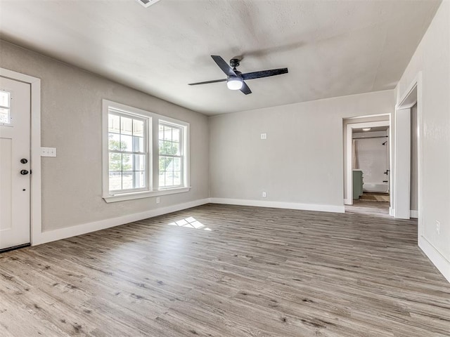 interior space featuring ceiling fan and light wood-type flooring