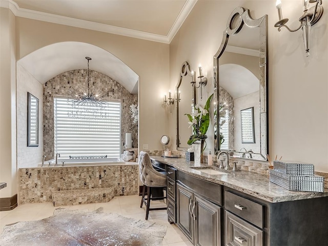 bathroom featuring a tub to relax in, ornamental molding, vanity, an inviting chandelier, and tile patterned flooring