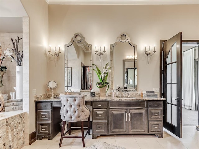 bathroom featuring tile patterned flooring and vanity