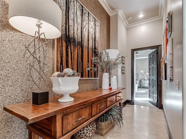 mudroom featuring crown molding and tile walls