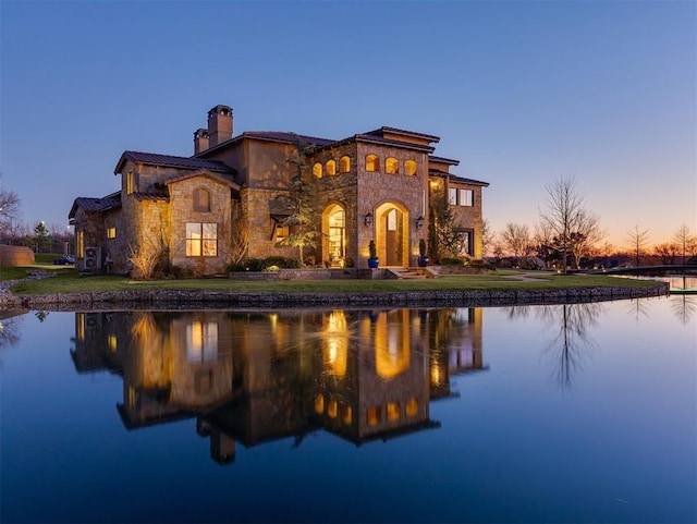 view of front of home featuring a water view