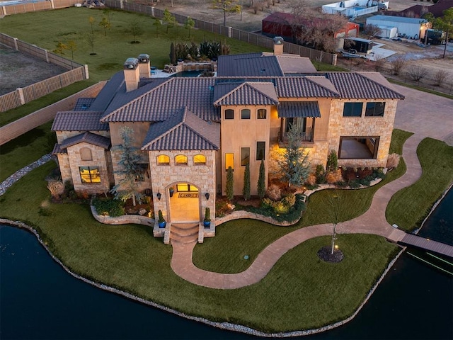 birds eye view of property with a water view