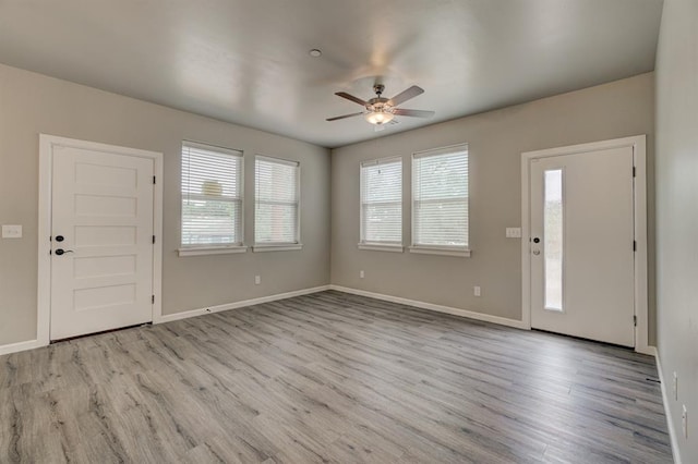 entrance foyer with ceiling fan and light hardwood / wood-style floors