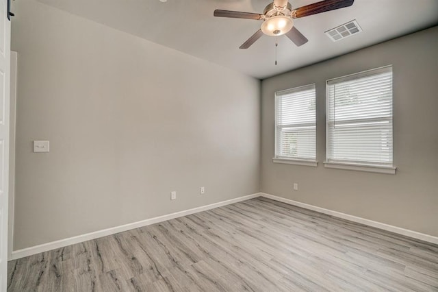 empty room featuring light hardwood / wood-style flooring and ceiling fan