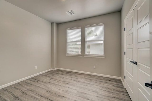 unfurnished bedroom with light hardwood / wood-style floors