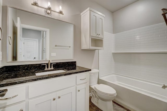 full bathroom with washtub / shower combination, vanity, and toilet