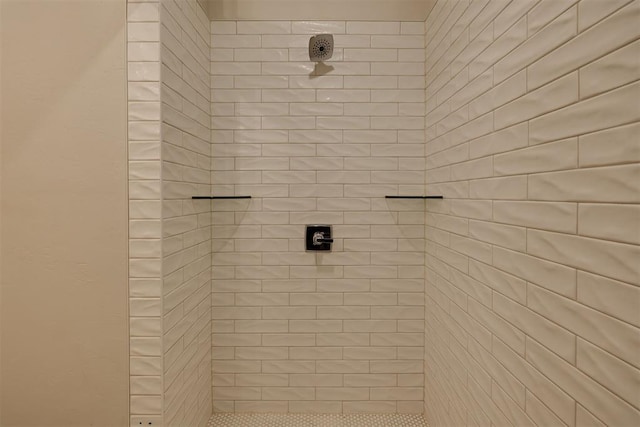 bathroom with a tile shower