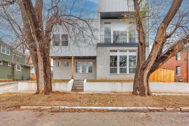 view of front of property with a balcony