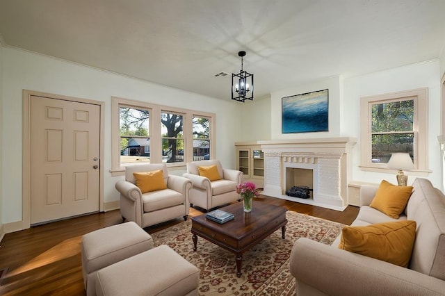 living room featuring dark hardwood / wood-style flooring and a chandelier