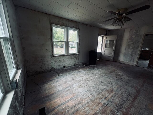 spare room with ceiling fan and dark wood-type flooring