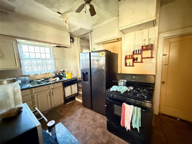 kitchen featuring dishwasher, dark tile patterned flooring, black gas stove, ceiling fan, and stainless steel fridge