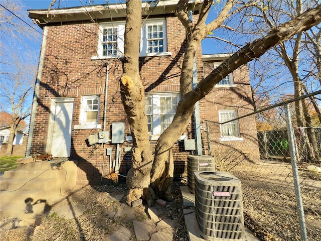 rear view of house with cooling unit