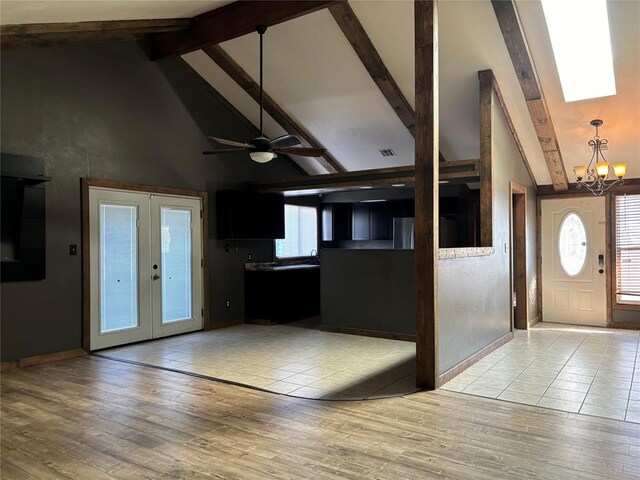 foyer featuring light wood-type flooring, french doors, high vaulted ceiling, ceiling fan with notable chandelier, and beamed ceiling