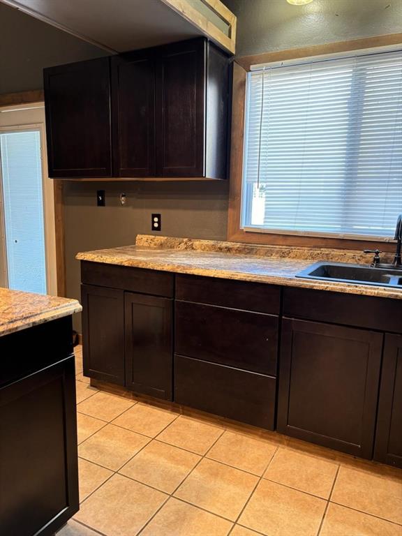 bathroom with sink and tile patterned floors