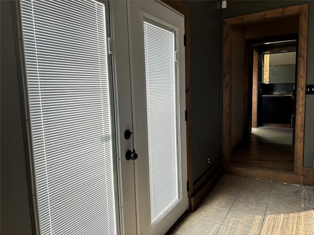 hallway featuring light tile patterned floors