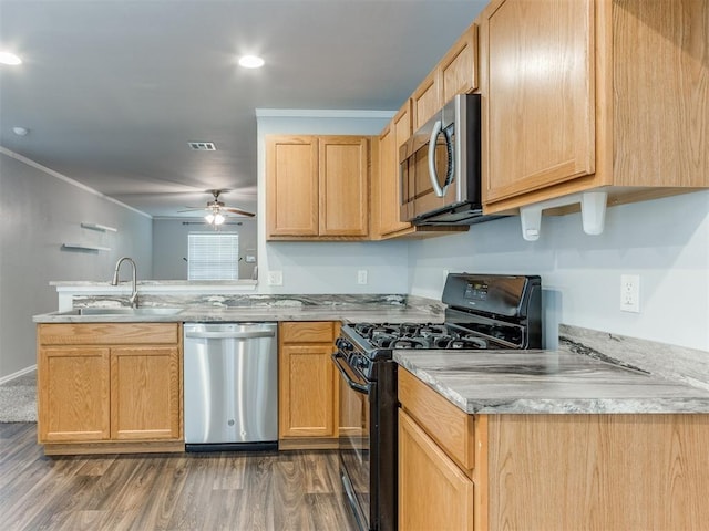 kitchen with ornamental molding, dark hardwood / wood-style flooring, stainless steel appliances, and sink