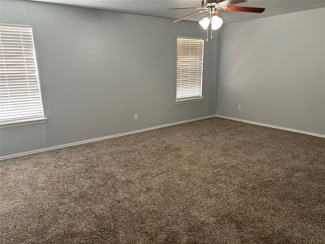 empty room featuring ceiling fan and carpet floors