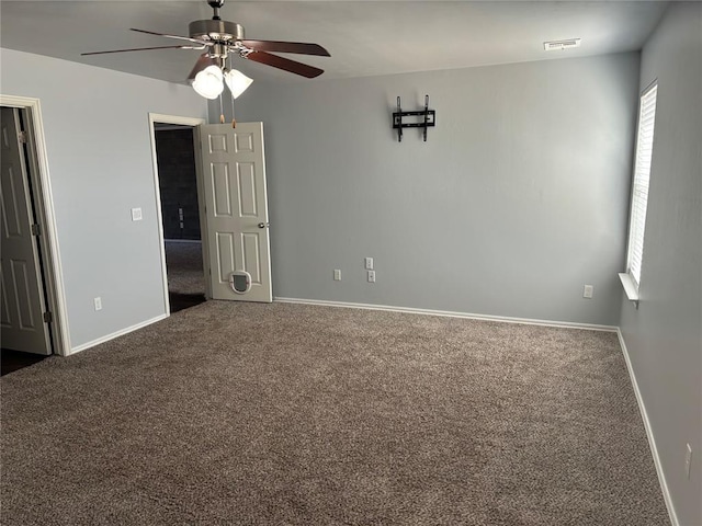 carpeted empty room with ceiling fan