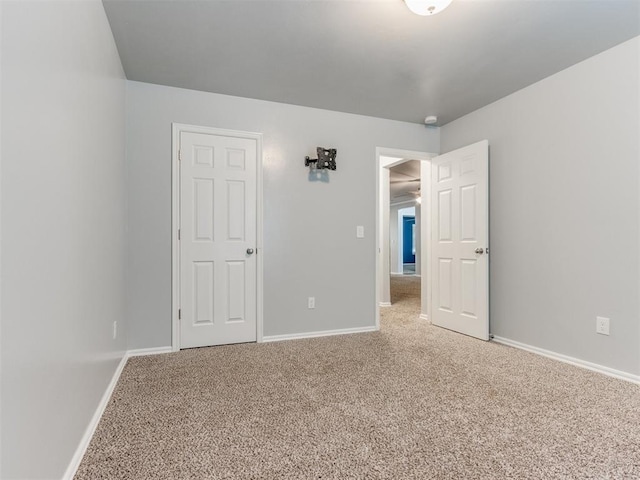 unfurnished bedroom featuring carpet flooring