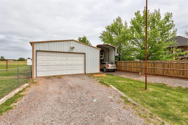 garage featuring a carport