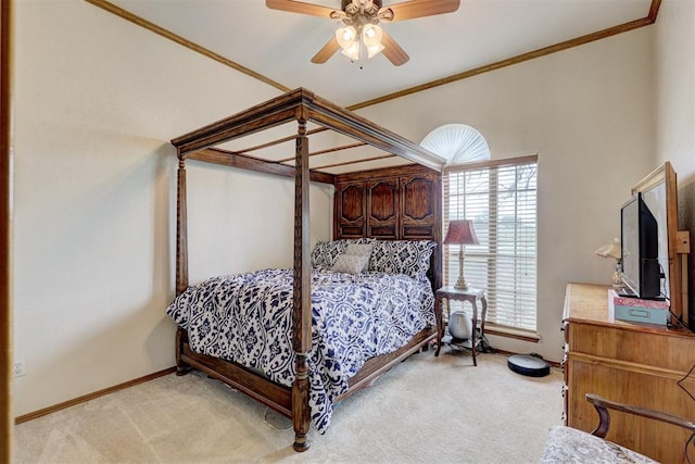 carpeted bedroom with ceiling fan and ornamental molding