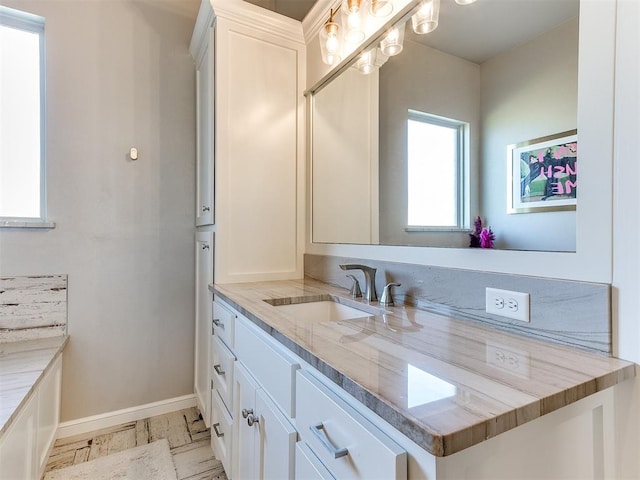 bathroom featuring vanity and wood-type flooring