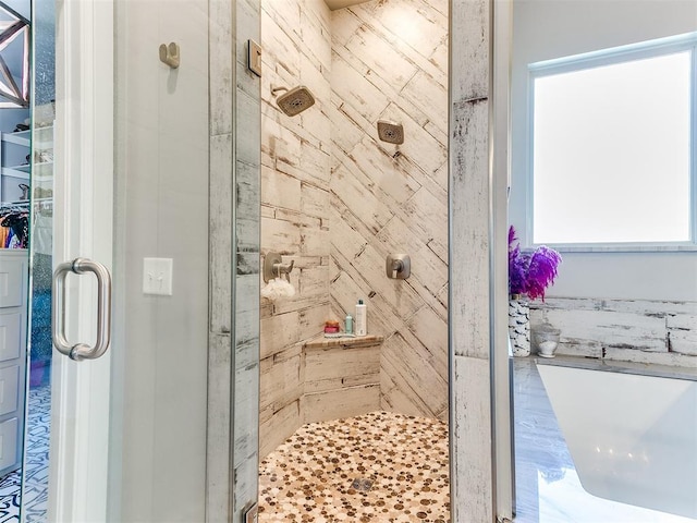 bathroom with a shower with shower door