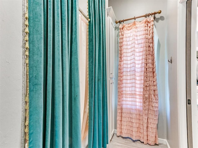 bathroom with hardwood / wood-style floors